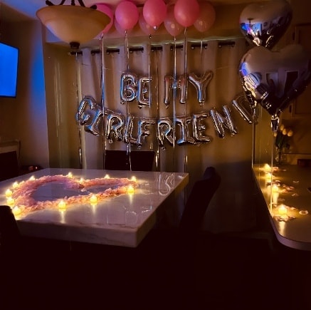 Be My Girlfriend proposal setup with silver balloon letters