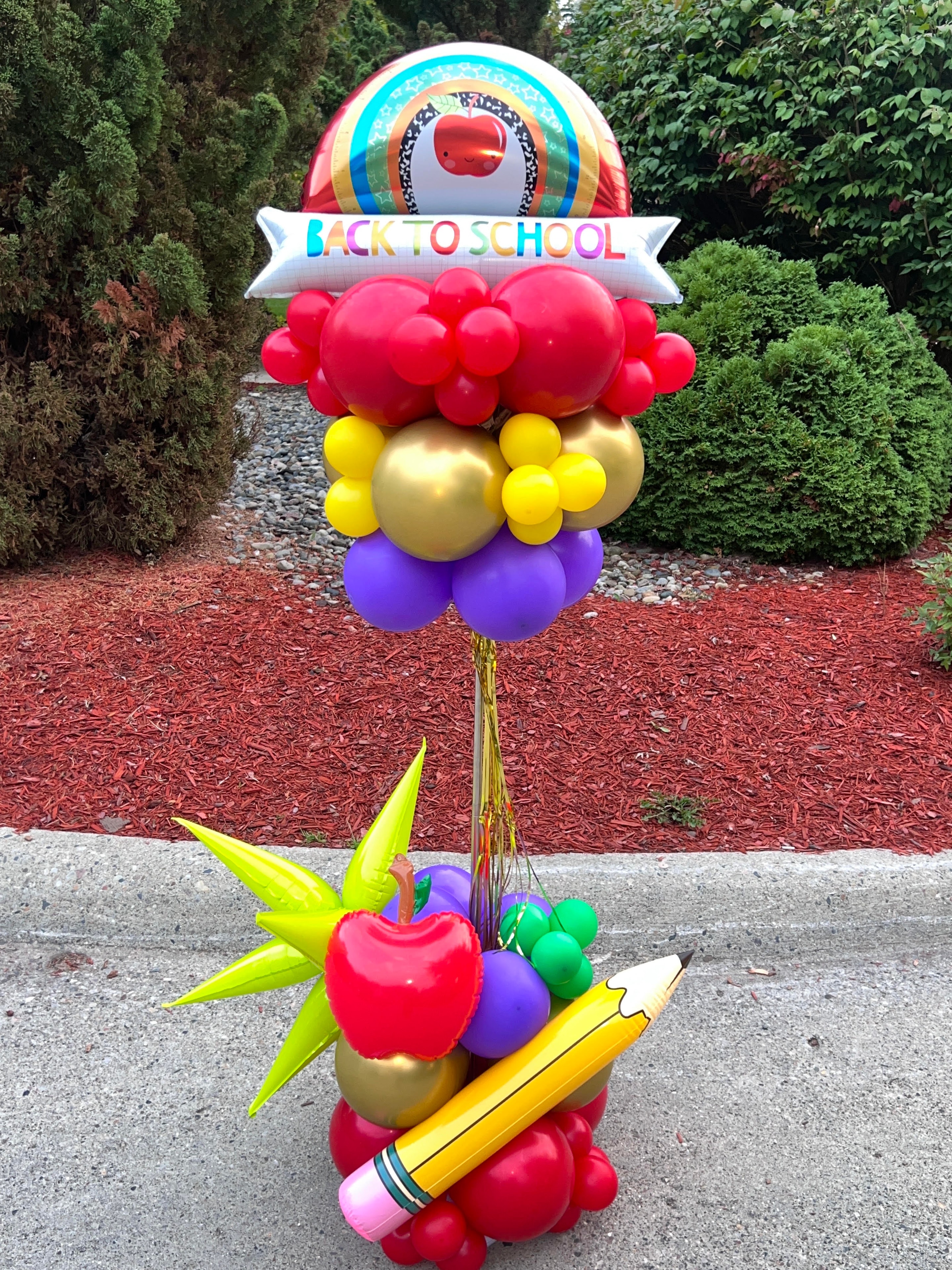 Back to school balloon column with apple, pencil, and rainbow foil balloons
